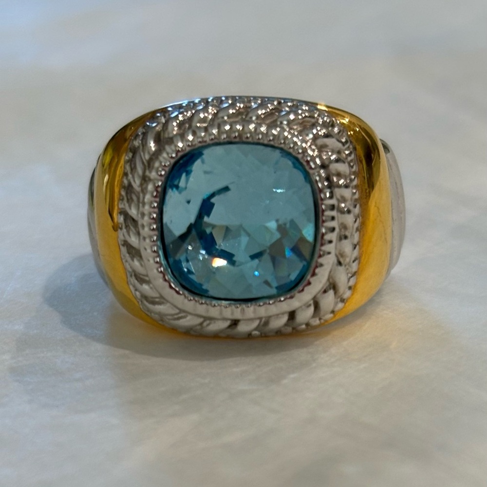 Joan Rivers ring featuring faux blue topaz set in silver & gold-tone accents.